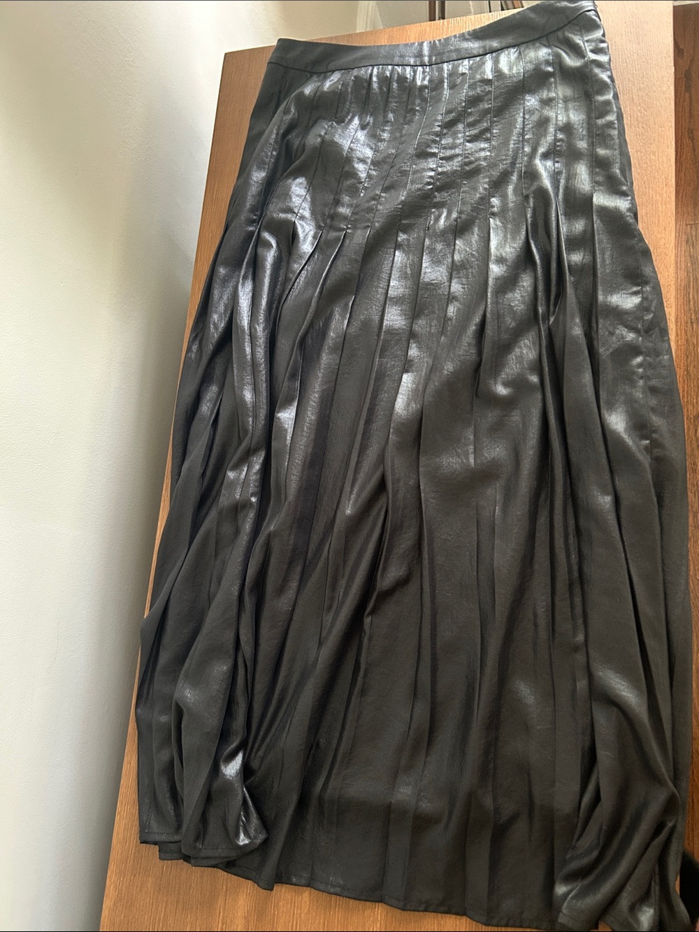 Black shiny pleated midi skirt